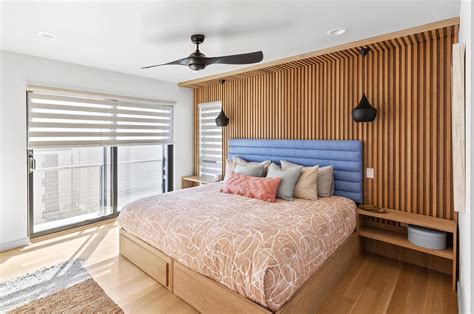 A Wood Accent Wall Adds Warmth To This Bedroom