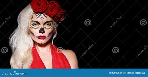 beautiful halloween make up style blond model wear sugar skull makeup with red roses santa