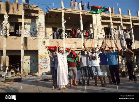 Libyan Rebels Celebrate As People Tour The Inside Of Baba Al Azizia Moammar Gaddafis Main
