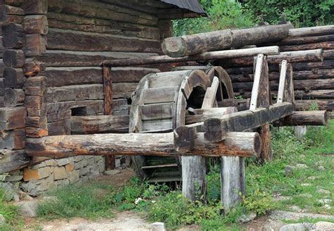 Old Wood Log Water Mill In Historical Country Homestead Stock Photo