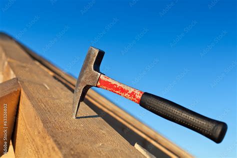 Carpenter Hammer Stuck Into A Wooden Beam Stock Photo Adobe Stock