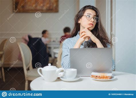 Portrait Of A Young Female Freelancer Using Laptop Computer For