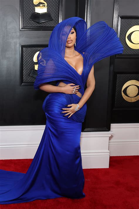 Cardi B Wows In Busty Cut Out Blue Gown With Striking Sheer Headpiece As She Stuns Alongside