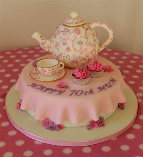 She is also cute and seems happy! Teapot and teacup cake. 70th birthday cake with cupcakes ...