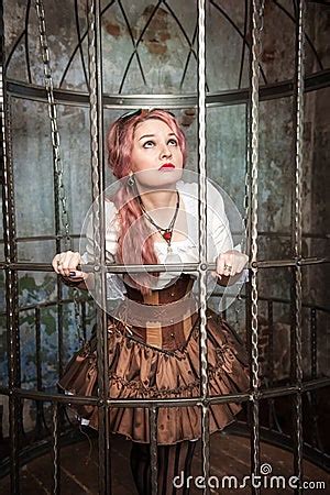Frightened Beautiful Steampunk Woman In The Cage Stock Photo Image