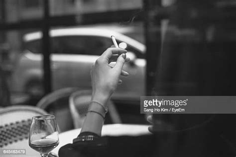 Female Hand Holding Cigarette Photos And Premium High Res Pictures