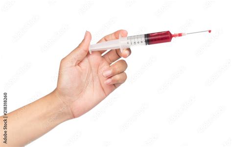 Hand Holding Blood Syringe For Injection Isolated On White Background