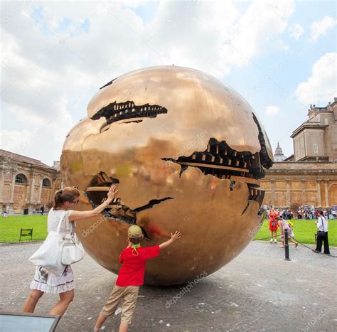 People around Sphere within sphere in Courtyard of the ...