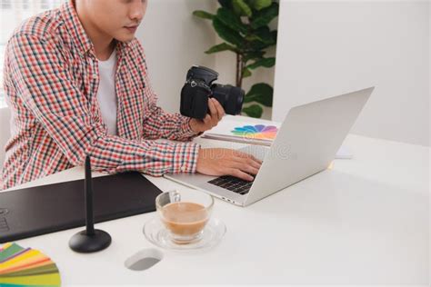 Photographer Working At Desk In Modern Office Stock Photo Image Of