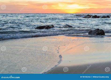 Sunrise Or Sunset Over The Sea View From Tropical Beach With Orange Sky