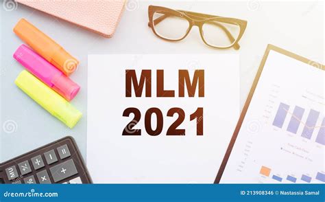 The Text Mlm 2021 Multilevel Marketing On Office Desk With Calculator