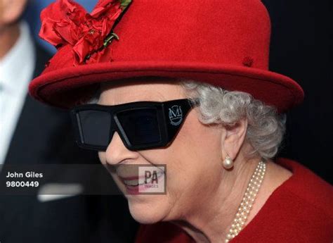 Queen Elizabeth Ii Wears 3 D Glasses To Watch A Display And Pilot A Jcb Digger During A Visit To