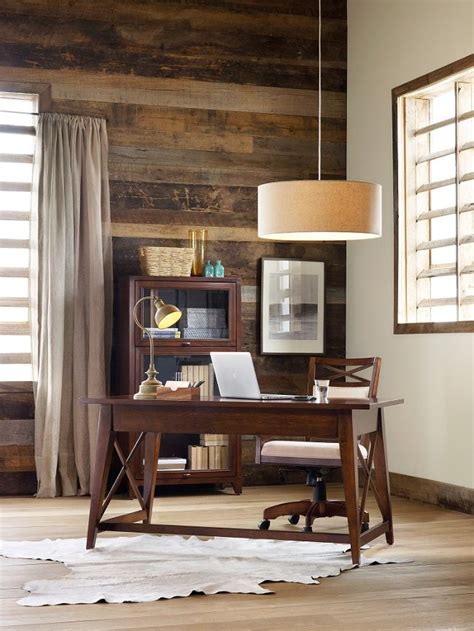 Wooden table on defocuced window with curtain background. Warm and rustic office with reclaimed wood wall. Love the ...
