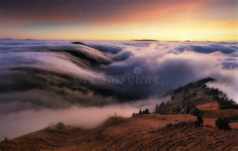 Colorfull Sunset Behind Mountain Peak Landscape Above Clouds Panorama