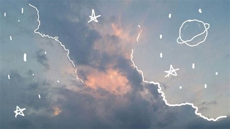 The Sky Is Filled With White Clouds And Stars As They Are Drawn On To Them