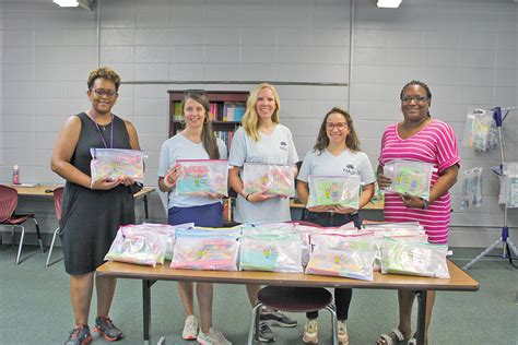 Education Junior Auxiliary Members Deliver 1600 School Supply Bags To