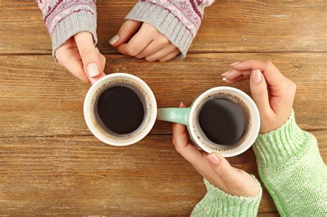 Female Hands Holding Cups Of Coffee Center For Healthy Churches