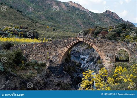 Old Stone Bridge Over The River In The Mountains Stock Photo Image Of