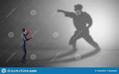 Young Businessman Fighting With His Shadow Stock Image Image Of
