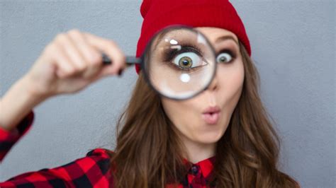 Woman Looking At Camera Through Magnifying Glass Dreamstime M 62137803 2 Job Crusher