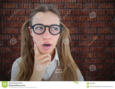 Close Up Of Nerd Woman Thinking Against Brick Wall Stock Image Image