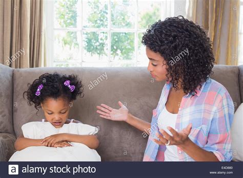 Pretty Mother Scolding Her Daughter On The Couch Stock Photo Alamy