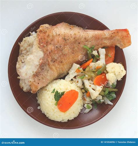 Fried Fish With Rice And Vegetables On A Plate Stock Photo Image Of