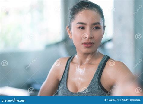 healthy woman is sweating while they exercising in fitness gym stock image image of health