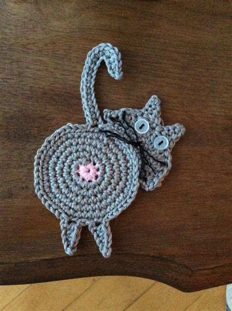 peeking cat butt coaster pattern by upper crust crochet acrylic yarn crochet crocheted item
