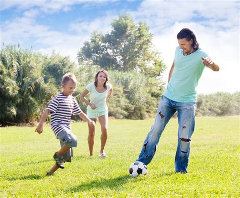 Parents With Child Playing With Soccer Ball Stock Image Image Of Ball