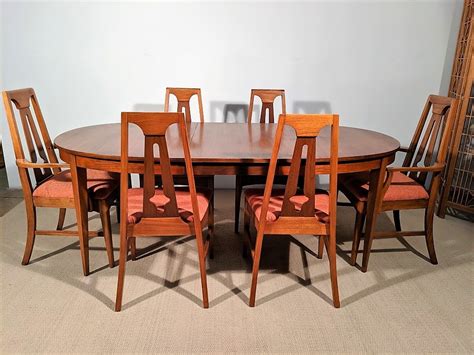A family gathering spot, a science project testing. Mid Century Modern Dining Set, Walnut Oval Table, One Leaf, Six Chairs, Young Furniture Co. - EPOCH