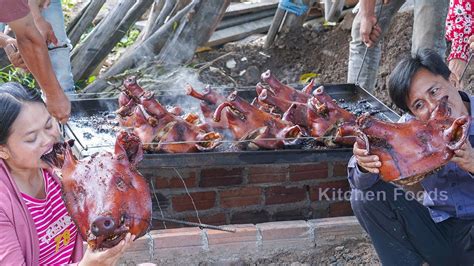 Eating And Roasted Pig Head In Underground Brick Oven Cooking Pig Head