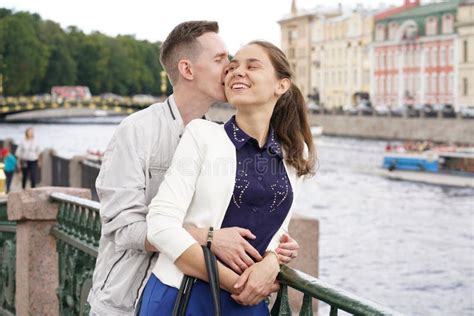 Charming Good Couple Husband And Wife Walking Around The City Hugging