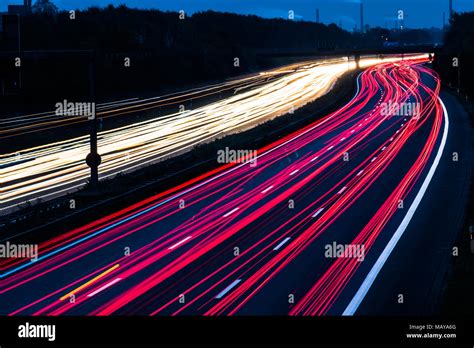 Highway At Night With Blurred Car Lights In A Long Exposure Shot Stock