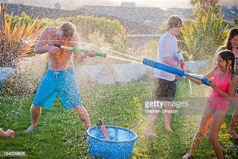 Adult Water Gun Fight Photos And Premium High Res Pictures Getty Images