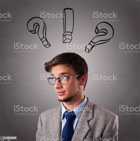 Young Man Thinking With Question Marks Overhead Stock Photo Download