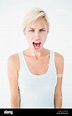 Angry blonde woman screaming Stock Photo - Alamy