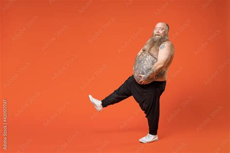 Full Length Side Profile View Of Fat Pudge Obese Chubby Overweight Tattooed Bearded Man Has Big