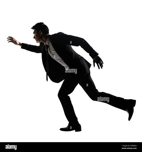 Silhouette Of Asian Business Man Running Stock Photo Alamy