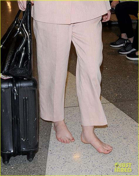 Elle Fanning Arrives At Lax Airport Without Shoes Photo