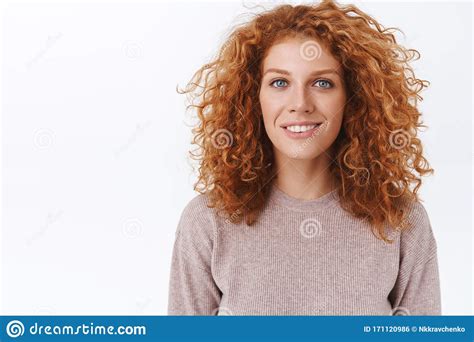 close up portrait attractive feminine lovely redhead woman with curly natural hair wear beige