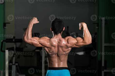 Bodybuilder Performing Rear Double Biceps Poses 949275 Stock Photo At