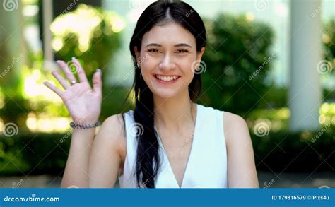 Young Beautiful Woman Smiling While Waving Hand Stock Image Image Of Female Outdoor 179816579