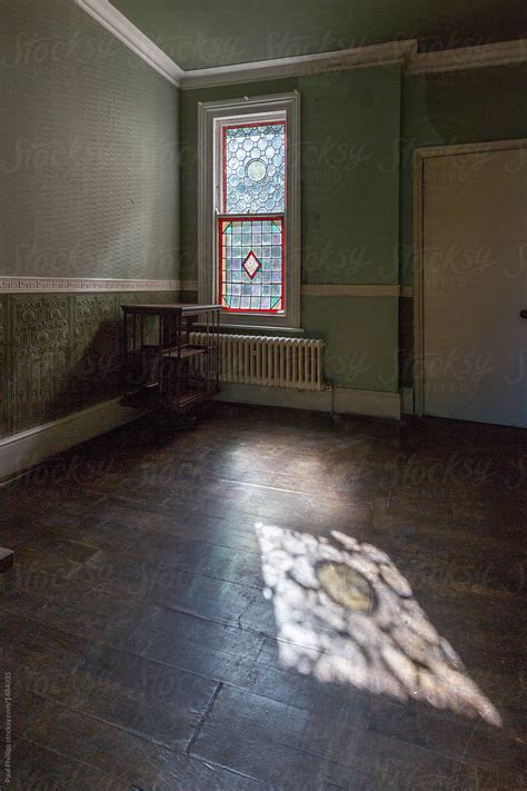 Corner Of A Room In An Old House With Sun Shining Through Stained Glass Window By Stocksy