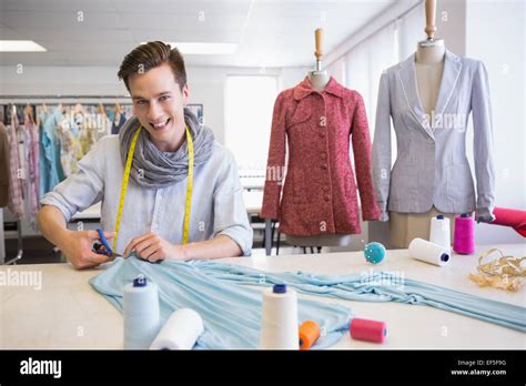 Student Cutting Fabric With Pair Of Scissors Stock Photo Alamy