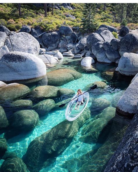 Addling Through Lake Tahoes Crystal Clear Waters Covered With Big