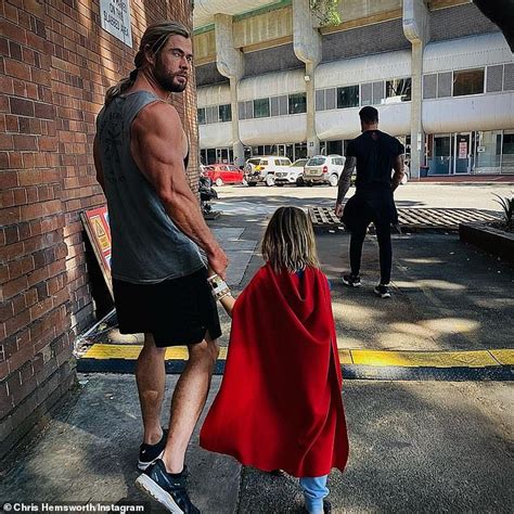 Thor Star Chris Hemsworth Flaunts His Bulging Biceps On Set With Son