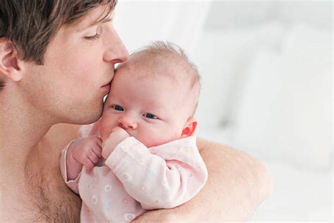 Dad Kissing Baby Chest Stock Photos Pictures And Royalty Free Images