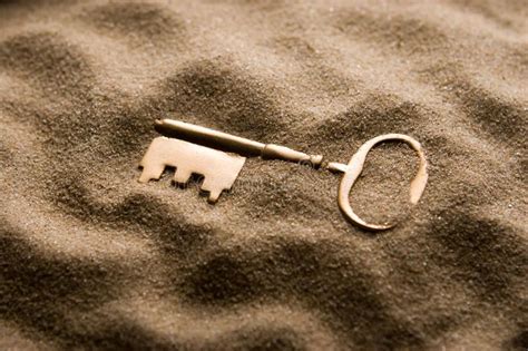 Lost Key Golden Retro Type Key Partially Buried In Sand Sponsored