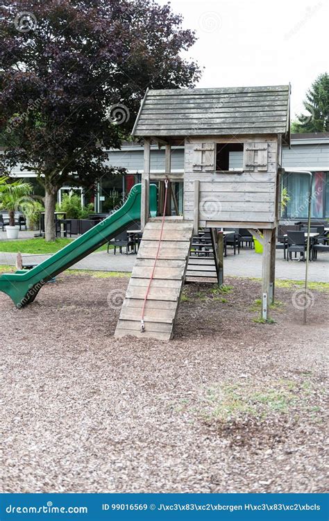 Children`s Slides With Wooden House On A Playground Stock Image Image